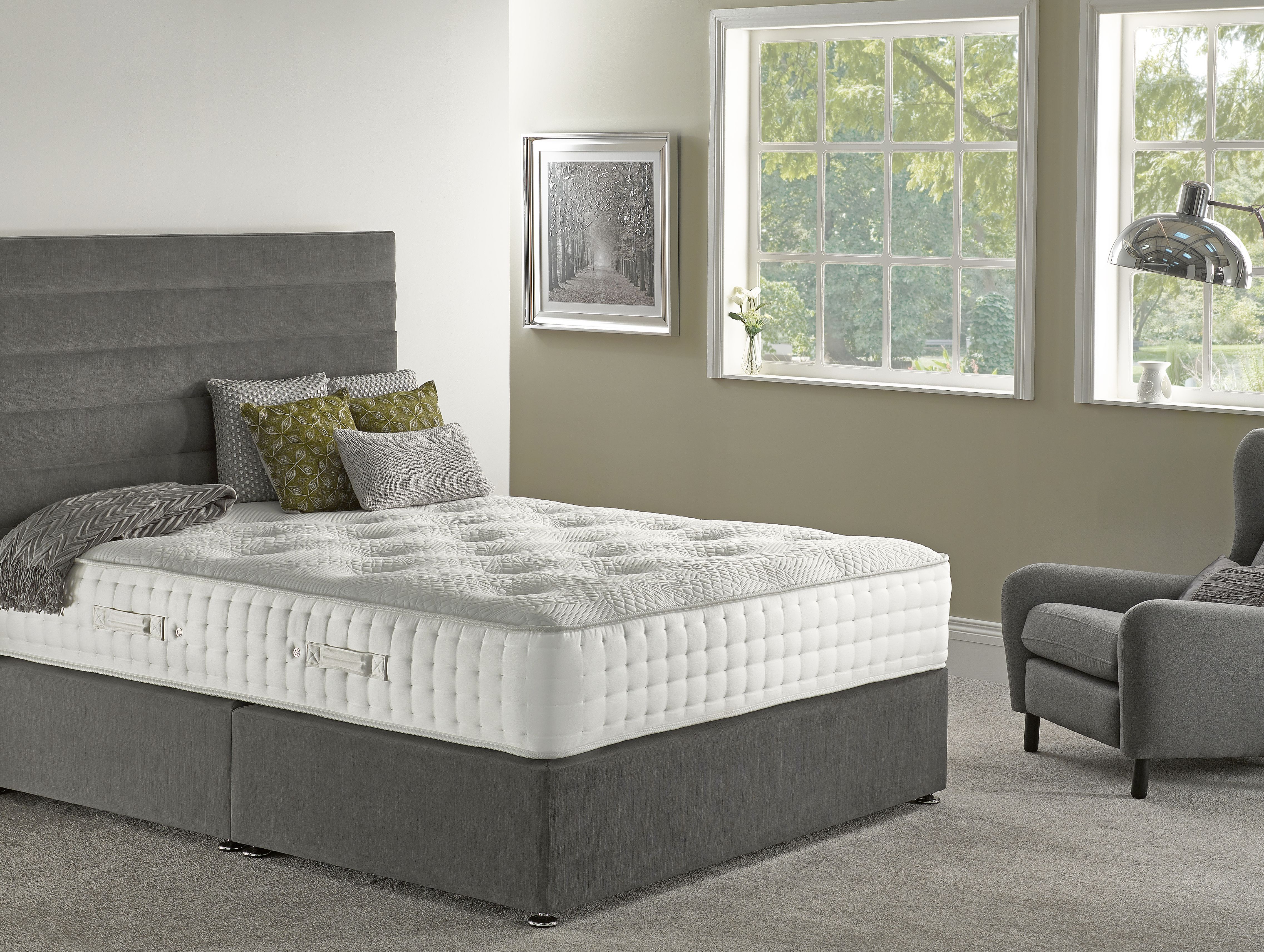 A brand new mattress on a bed